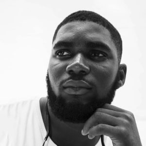 monochrome-portrait-of-a-thoughtful-african-man-with-facial-hair-in-abuja-nigeria.-20335884-scaled